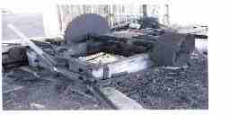 An antique sawmill with its disc-shaped blade.