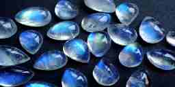 An array of teardrop-shaped blue moonstones..